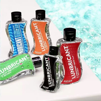 Assorted RealVagina 200ml Water Based Lube Lasts Long & Easy to Clean bottles displayed beside a pool